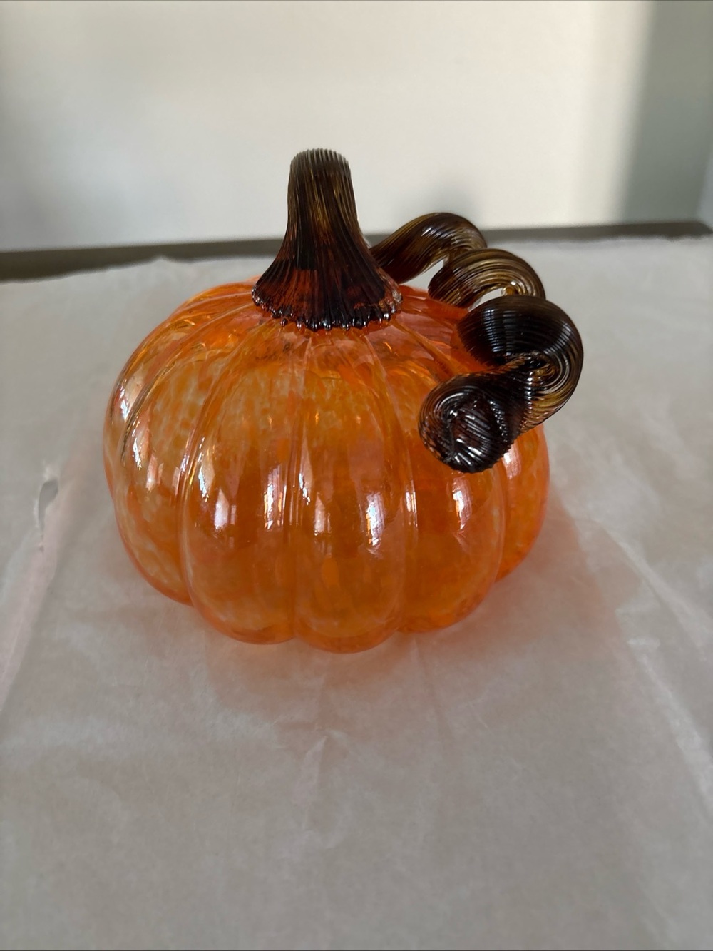 Handblown Glass Pumpkin.

Beautiful colors of light orange white with Brown stem